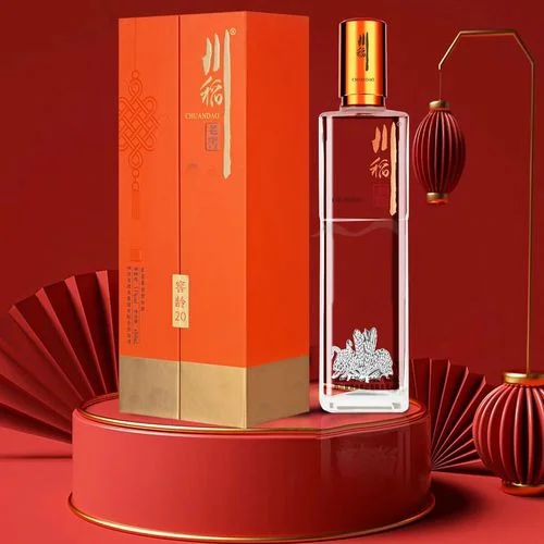 婚宴酒席上摆放的多种喜庆包装白酒，包括茅台、五粮液等品牌，搭配喜糖和喜字装饰。_1